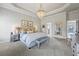 Serene main bedroom featuring a chandelier, a sitting area, and neutral decor at 3952 Dragon Fly Ln, Loganville, GA 30052
