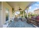 The home includes a covered patio with comfortable seating, a ceiling fan, and space for grilling, perfect for outdoor gatherings at 3952 Dragon Fly Ln, Loganville, GA 30052