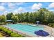 Enjoy a refreshing swim in the community pool, surrounded by lounge chairs and lush greenery at 3952 Dragon Fly Ln, Loganville, GA 30052