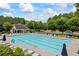 The community features a sparkling swimming pool with plenty of lounge chairs for relaxing by the water at 3952 Dragon Fly Ln, Loganville, GA 30052
