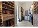 Large, custom walk-in closet with built-in shelves, drawers, and ample hanging space at 3952 Dragon Fly Ln, Loganville, GA 30052