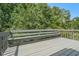 Back deck with bench overlooking lush, green backyard at 1105 Tom Lane Ln, Marietta, GA 30066