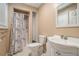 Bright bathroom with modern fixtures and a shower with decorative curtain at 1105 Tom Lane Ln, Marietta, GA 30066