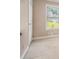Bright bedroom features a neutral color palette, door, and window at 1105 Tom Lane Ln, Marietta, GA 30066