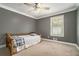 Cozy bedroom with natural light, ceiling fan, and neutral color palette at 1105 Tom Lane Ln, Marietta, GA 30066