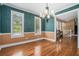 Formal dining room with hardwood floors, a chandelier, and plenty of natural light at 1105 Tom Lane Ln, Marietta, GA 30066