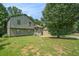 Charming home with a well-manicured lawn and mature trees offering a serene setting at 1105 Tom Lane Ln, Marietta, GA 30066