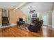 Living room with cathedral ceilings, hardwood floors, and stone fireplace, perfect for relaxing at 1105 Tom Lane Ln, Marietta, GA 30066