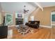 Spacious living room with vaulted ceilings, wood floors, stone fireplace and plenty of light at 1105 Tom Lane Ln, Marietta, GA 30066