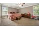 Generous main bedroom with plush carpet, soft paint, ceiling fan and large windows at 1105 Tom Lane Ln, Marietta, GA 30066