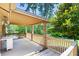 Covered back porch with brick pillars offers ample space for outdoor relaxation at 255 Jade Cove Dr, Roswell, GA 30075