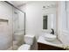 Updated bathroom with a glass enclosed shower, modern vanity and new fixtures at 255 Jade Cove Dr, Roswell, GA 30075