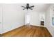 Spacious bedroom with hardwood floors and a doorway leading to a bathroom at 255 Jade Cove Dr, Roswell, GA 30075