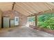 Brick carport with storage and access to the back porch and backyard at 255 Jade Cove Dr, Roswell, GA 30075