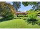 Well-maintained front yard with mature trees and lush green grass, perfect for outdoor enjoyment at 255 Jade Cove Dr, Roswell, GA 30075