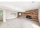 Spacious room features a brick fireplace and tile flooring throughout at 255 Jade Cove Dr, Roswell, GA 30075