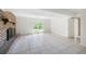 Room featuring a brick fireplace and access to the backyard through French doors at 255 Jade Cove Dr, Roswell, GA 30075