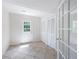 Sunroom with tile floors, a glass door to the outside, and french doors at 255 Jade Cove Dr, Roswell, GA 30075