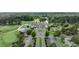 Aerial view of the property, golf course and lush landscape from a bird's eye view at 562 Pine Valley Se Rd, Marietta, GA 30067