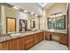 Bathroom featuring a dual sink vanity with granite countertop and ample storage at 562 Pine Valley Se Rd, Marietta, GA 30067