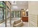 Luxurious bathroom featuring a sunken tub, shower, and many windows for natural light at 562 Pine Valley Se Rd, Marietta, GA 30067