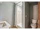 Cozy bathroom featuring a shower and a white toilet at 562 Pine Valley Se Rd, Marietta, GA 30067