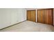 Neutral bedroom with carpet, white walls, and wood trim doors at 562 Pine Valley Se Rd, Marietta, GA 30067