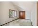 Spacious bedroom with carpet, white walls, and window at 562 Pine Valley Se Rd, Marietta, GA 30067