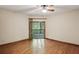 Bedroom with ceiling fan, hardwood floors, and sliding door to the deck at 562 Pine Valley Se Rd, Marietta, GA 30067