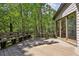 Wide wooden deck with bench overlooking serene trees at 562 Pine Valley Se Rd, Marietta, GA 30067