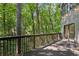 Spacious deck surrounded by lush greenery, perfect for outdoor entertaining at 562 Pine Valley Se Rd, Marietta, GA 30067