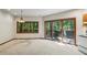 Bright dining room with carpet, a window, and sliding door access to the deck at 562 Pine Valley Se Rd, Marietta, GA 30067