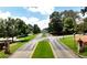 Gated drive leading to a large estate showcasing manicured lawn and lush landscaping at 562 Pine Valley Se Rd, Marietta, GA 30067