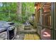Patio area with stone landscaping and water feature, alongside a grill at 562 Pine Valley Se Rd, Marietta, GA 30067