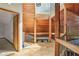 Open foyer featuring hardwood floors, exposed wood beams, and a high ceiling at 562 Pine Valley Se Rd, Marietta, GA 30067