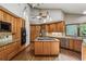 Spacious kitchen with wood cabinets, stainless steel appliances, granite countertops and hardwood flooring at 562 Pine Valley Se Rd, Marietta, GA 30067