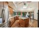 Bright kitchen with an island, stainless appliances, tile backsplash, and wood floors at 562 Pine Valley Se Rd, Marietta, GA 30067