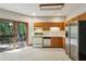 Kitchen with stainless steel appliances, wood cabinets, and a sliding door to the deck at 562 Pine Valley Se Rd, Marietta, GA 30067