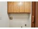 Laundry area with wood cabinets and hookups at 562 Pine Valley Se Rd, Marietta, GA 30067