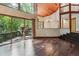 Living room with hardwood floors, wood ceiling, sliding glass doors, and open floorplan at 562 Pine Valley Se Rd, Marietta, GA 30067