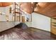 Living room featuring hardwood floors and a wood ceiling, with steps up to entryway at 562 Pine Valley Se Rd, Marietta, GA 30067