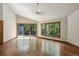 Bright living room with hardwood floors, large windows, and sliding door to outdoor deck at 562 Pine Valley Se Rd, Marietta, GA 30067