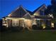 Charming two-story home exterior with stone and siding, showcasing a covered porch, manicured lawn, and inviting curb appeal at 848 Rolling Nw Hl, Kennesaw, GA 30152