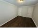 This is a bedroom with hardwood floors, neutral walls and doors at 1106 Sharonton Way, Stone Mountain, GA 30083