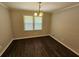 Dining room featuring hardwood floors, a chandelier, and natural light at 1106 Sharonton Way, Stone Mountain, GA 30083
