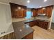Kitchen featuring granite counters, tile backsplash, and stainless steel appliances at 1106 Sharonton Way, Stone Mountain, GA 30083