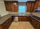 Kitchen featuring stainless steel appliances, tile backsplash and warm wood cabinets at 1106 Sharonton Way, Stone Mountain, GA 30083
