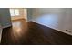 Inviting living room with gleaming hardwood floors and light gray paint at 1106 Sharonton Way, Stone Mountain, GA 30083