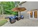 Inviting patio with comfortable seating, an umbrella, and a relaxing outdoor ambiance at 127 Bradshaw Park Dr, Woodstock, GA 30188