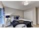 Cozy bedroom featuring a metal bed frame, closet, and ample natural light from the window at 127 Bradshaw Park Dr, Woodstock, GA 30188